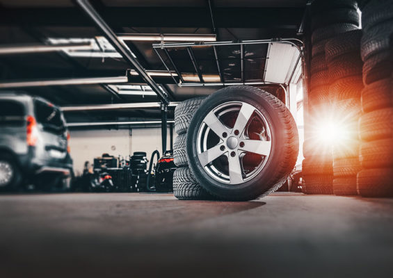 Tire,At,Repairing,Service,Garage,Background.,Technician,Man,Replacing,Winter